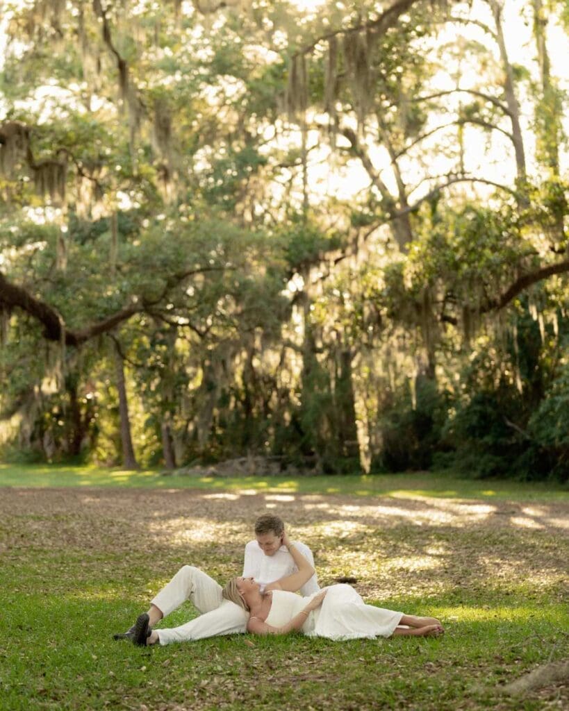 dreamy golden hour photos of a couple under the oak trees on hilton head island during an engagment photo session