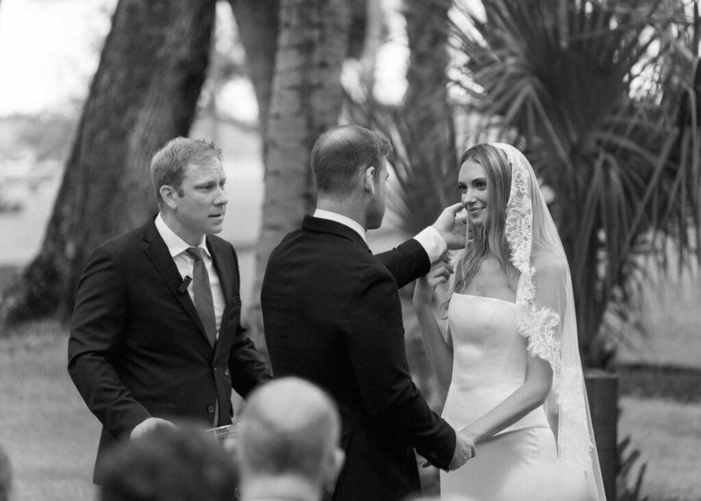 Wedding ceremony outside under the oak trees on Hilton Head Island, SC. Romantic couples photo